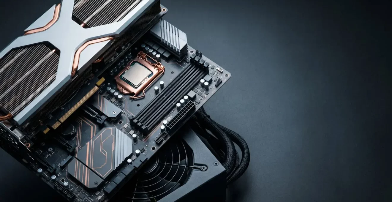 Close-up arrangement of modern PC components showing cascading upgrade dependencies with dramatic lighting