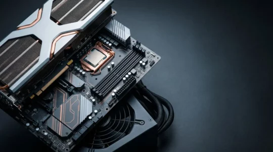 Close-up arrangement of modern PC components showing cascading upgrade dependencies with dramatic lighting
