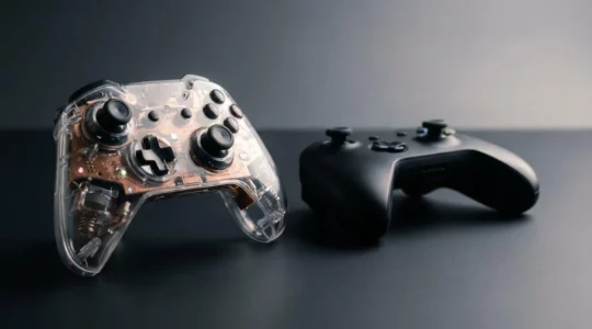 High-end gaming controller with exposed precision components in professional studio lighting