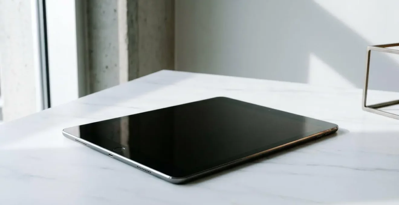 Professional tablet device positioned in a modern minimalist workspace showing sophisticated hardware architecture without visible text or screens